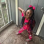Nevaeh joined the competition — help win amazing prizes! child, girl, braids, pink_clothing, pajamas, bow, smile, peace_sign, wooden_floor, door, porch, outdoor, happy, playful, person, hair_accessory, footwear, casual, pose, young