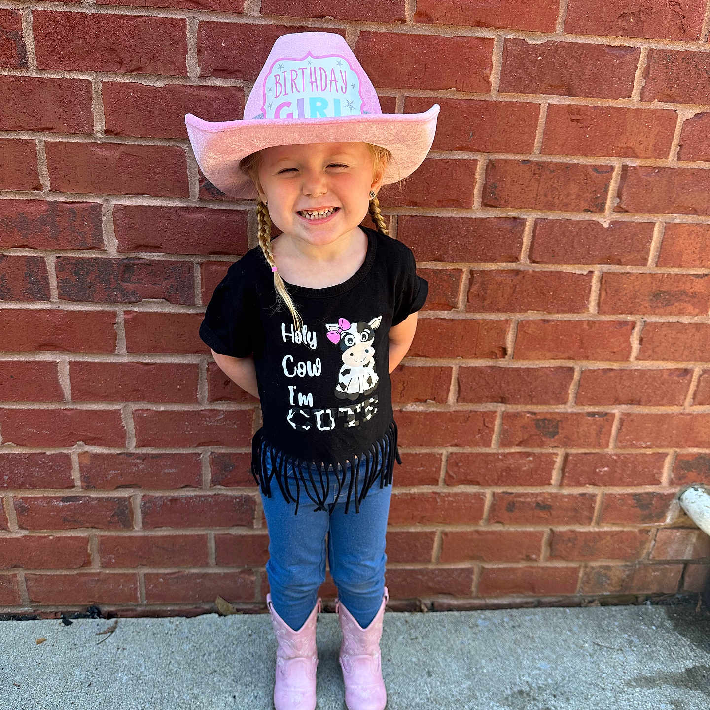 Lakelyn is registered to the contest to win money with this photo: architecture, brick, building, child, clothing, cowboyhat, face, female, footwear, girl, hat, head, jeans, pants, person, photography, portrait, shoe, sunhat, t_shirt