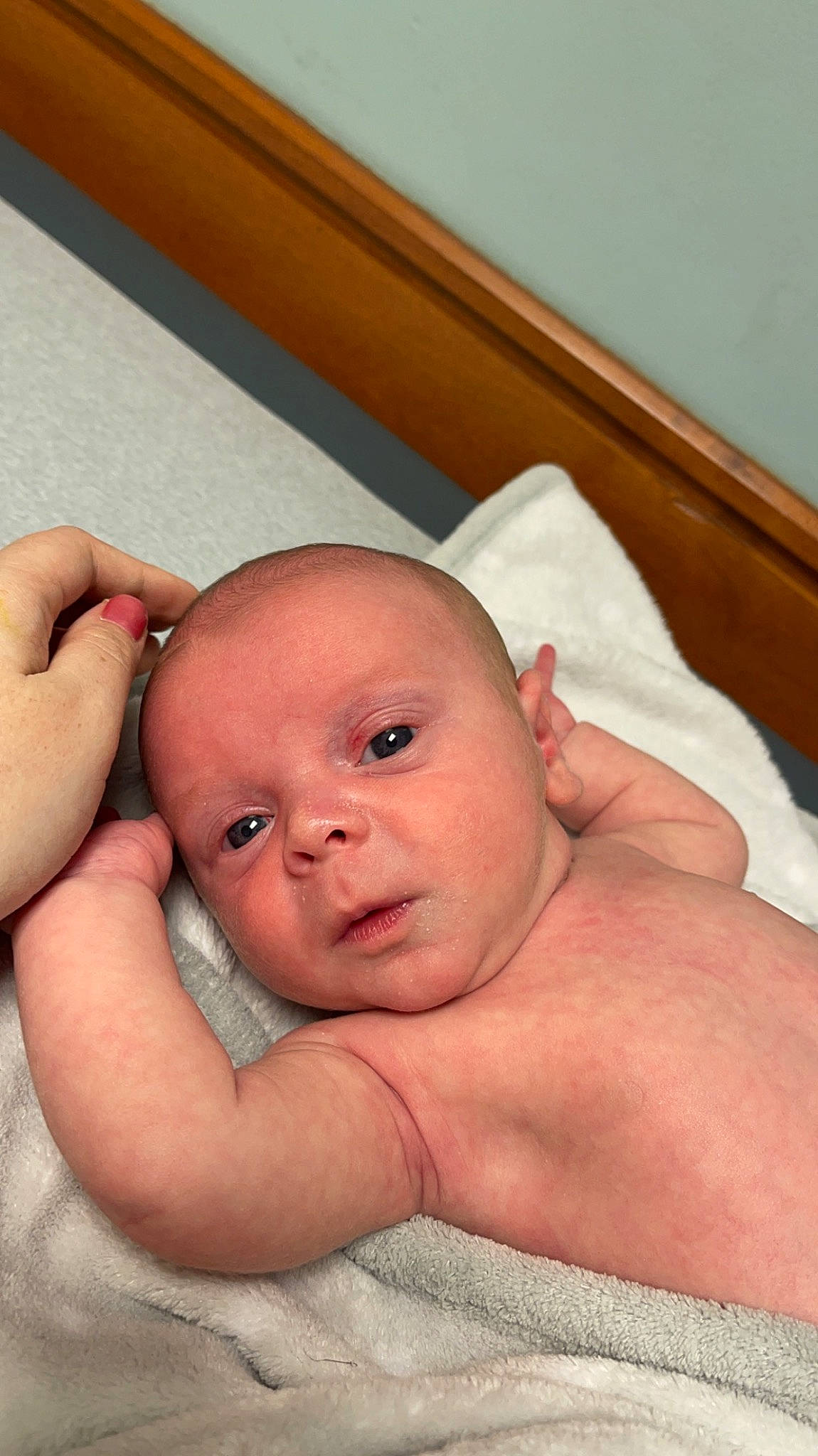 Nikolai is registered to the contest to win money with this photo: baby, cheek, chest, comfort, eye, eyebrow, eyelash, face, finger, gesture, hand, head, human_body, lip, mouth, neck, nose, person, skin, stomach