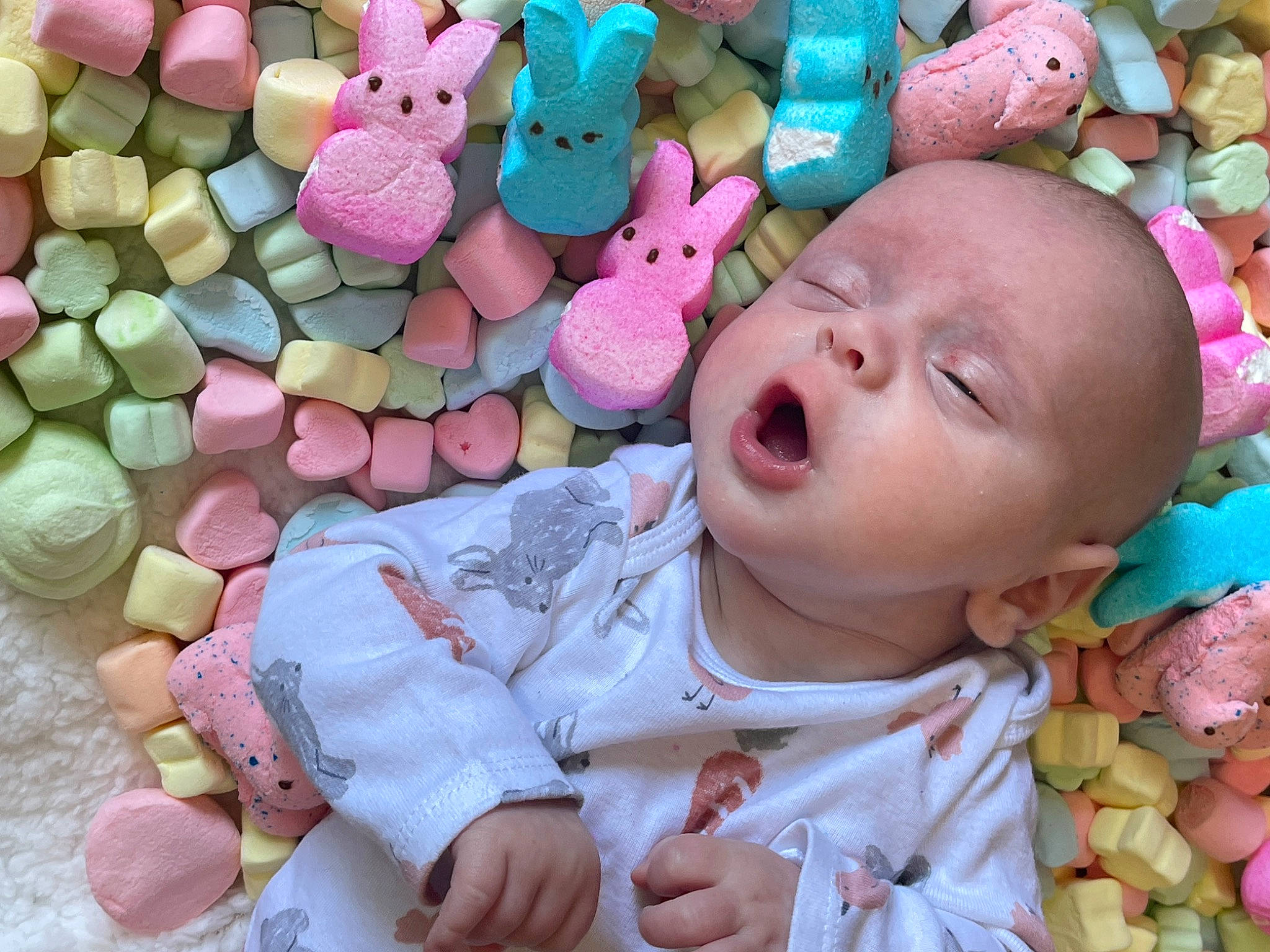 Nikolai is registered to the contest to win money with this photo: baby, baby_toddler_clothing, cheek, child, eye, human_body, mouth, nose, organ, pattern, people, person, photograph, pink, skin, stuffed_toy, sweetness, textile, toddler, toy