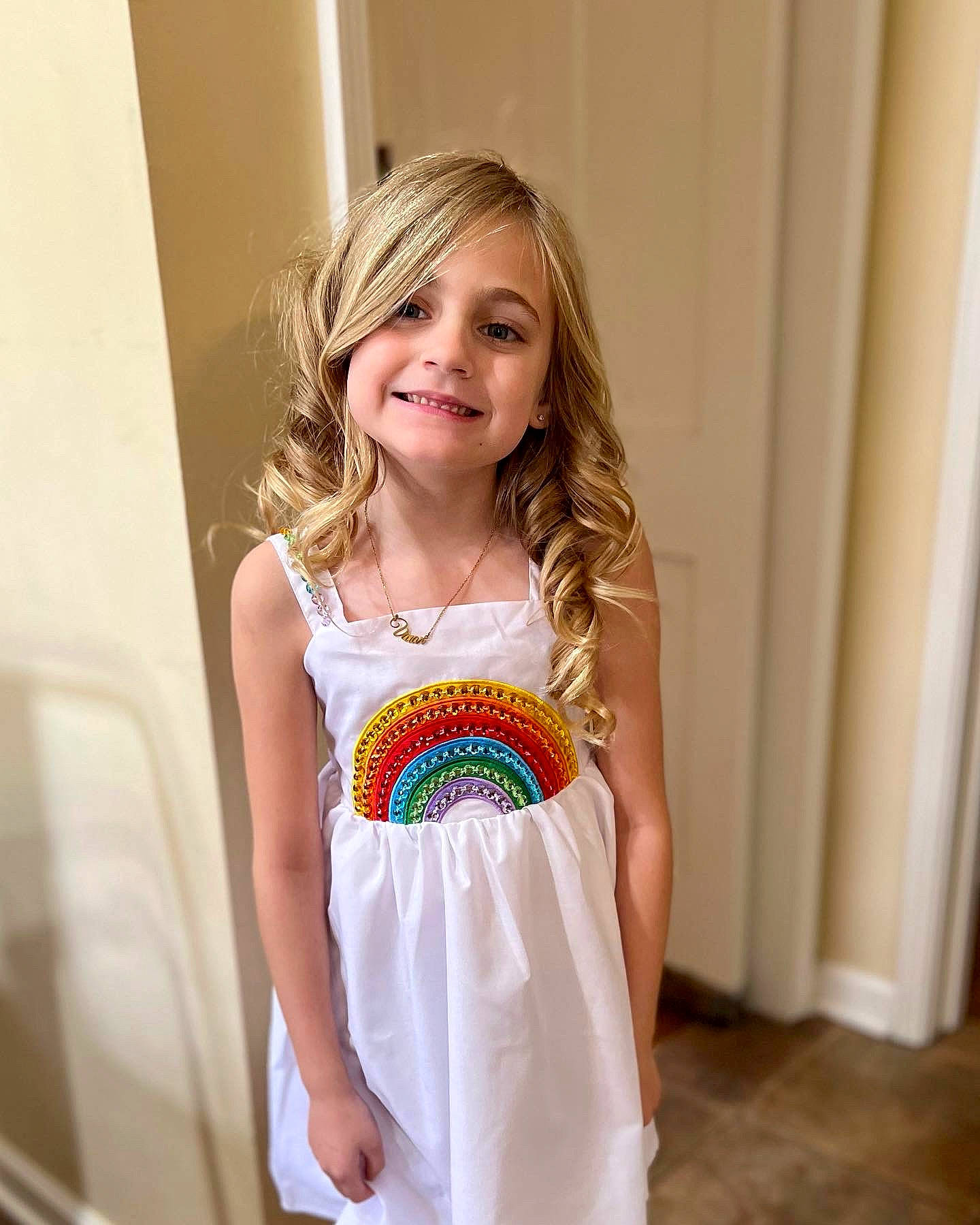 Vivian is registered to the contest to win money with this photo: blond, day_dress, dress, electric_blue, face, fashion_design, formal_wear, happy, iris, jewellery, joy, neck, necklace, one_piece_garment, person, sleeve, smile, sportswear, t_shirt, toddler