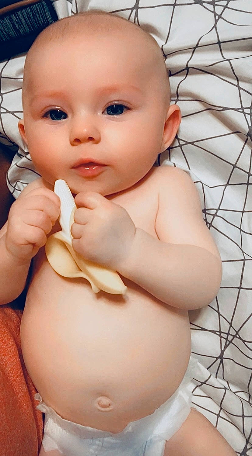 Finley joined the competition — help win amazing prizes! arm, baby, cheek, chest, chin, eyebrow, eyelash, finger, gesture, hand, human_body, joint, leg, lip, mouth, neck, nose, person, skin, stomach