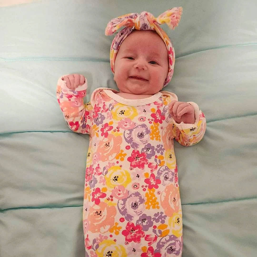Ayva joined the competition — help win amazing prizes! baby, baby_products, baby_sleeping, baby_toddler_clothing, child, comfort, face, happy, headband, headwear, joy, linens, magenta, pattern, peach, person, pink, skin, sleeve, smile