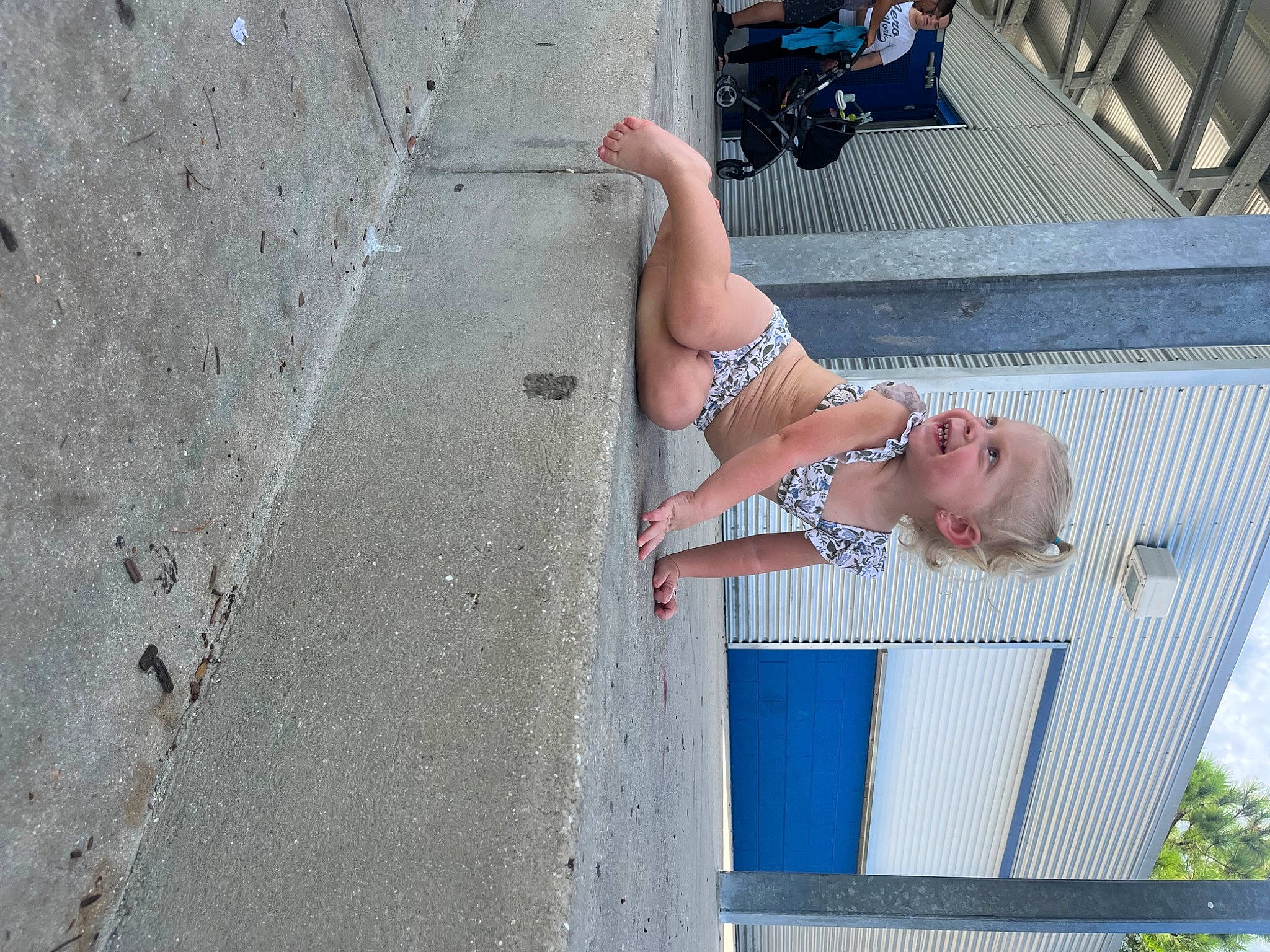 Raelynn is registered to the contest to win money with this photo: barechested, barefoot, calf, elbow, foot, fun, human_body, human_leg, joy, knee, leg, leisure, line, person, road_surface, sandal, sunglasses, thigh, toe, tree