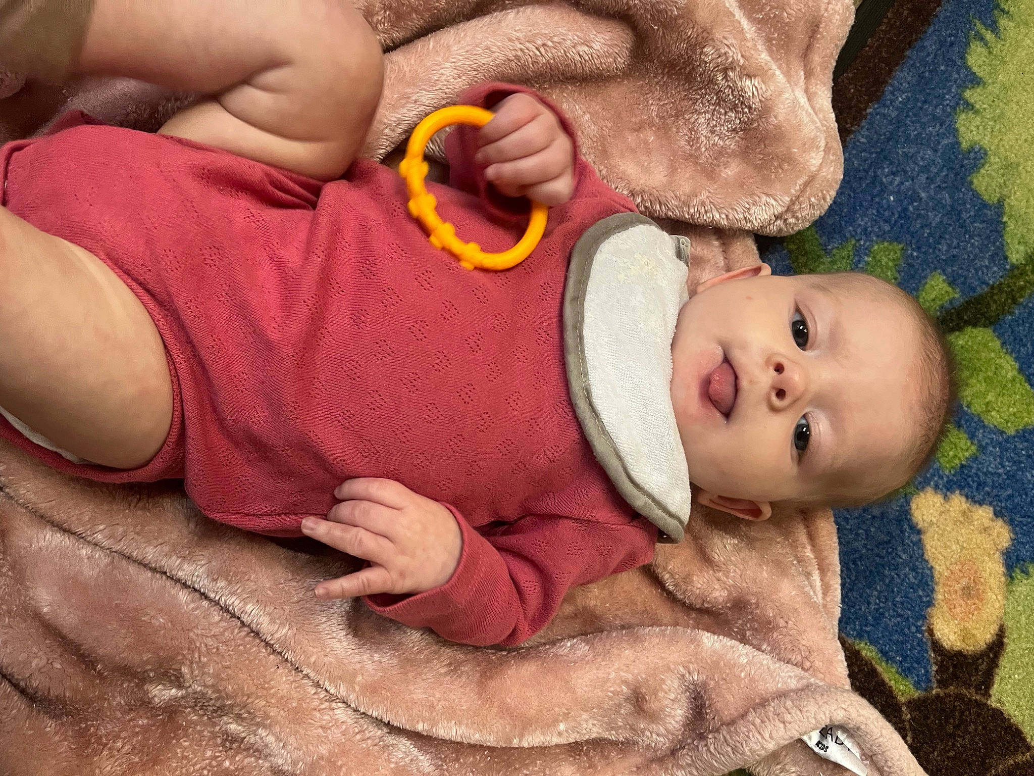 Remi is registered to the contest to win money with this photo: abdomen, arm, baby, baby_products, baby_toddler_clothing, cheek, child, comfort, gesture, hand, happy, navel, nose, person, skin, stomach, thigh, thumb, toddler, wood