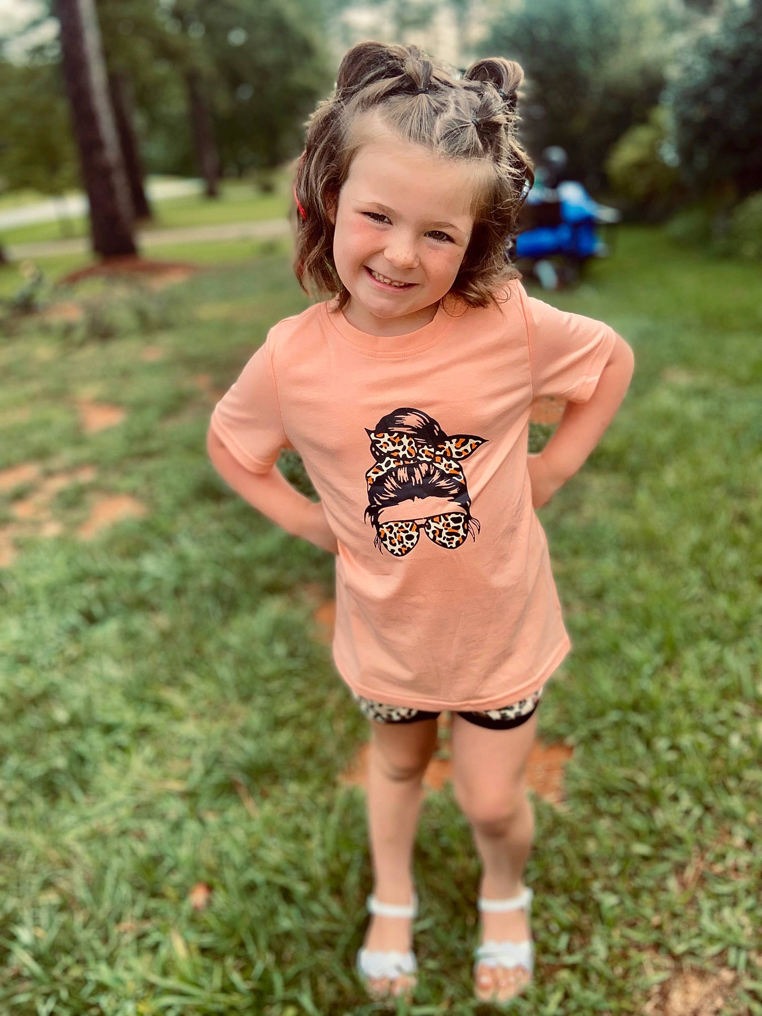 Briella is registered to the contest to win money with this photo: baby_toddler_clothing, child, eye, fun, grass, grassland, happy, head, joy, leisure, pattern, people_in_nature, person, plant, recreation, sandal, shorts, sleeve, smile, t_shirt