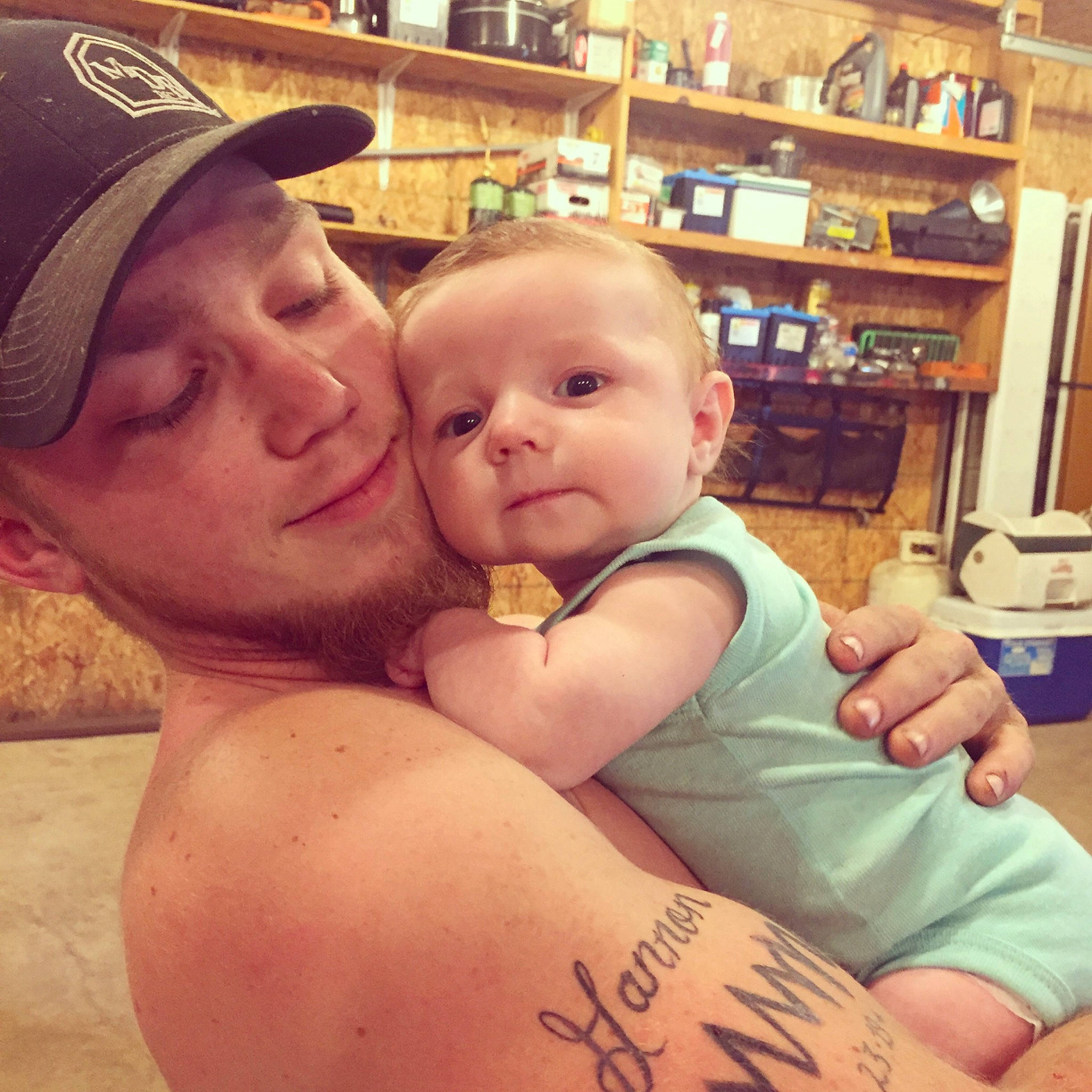 Gannon is registered to the contest to win money with this photo: baby, cheek, child, daughter, father, happy, love, mother, muscle, person, selfie, skin, smile, tattoo, thumb, toddler