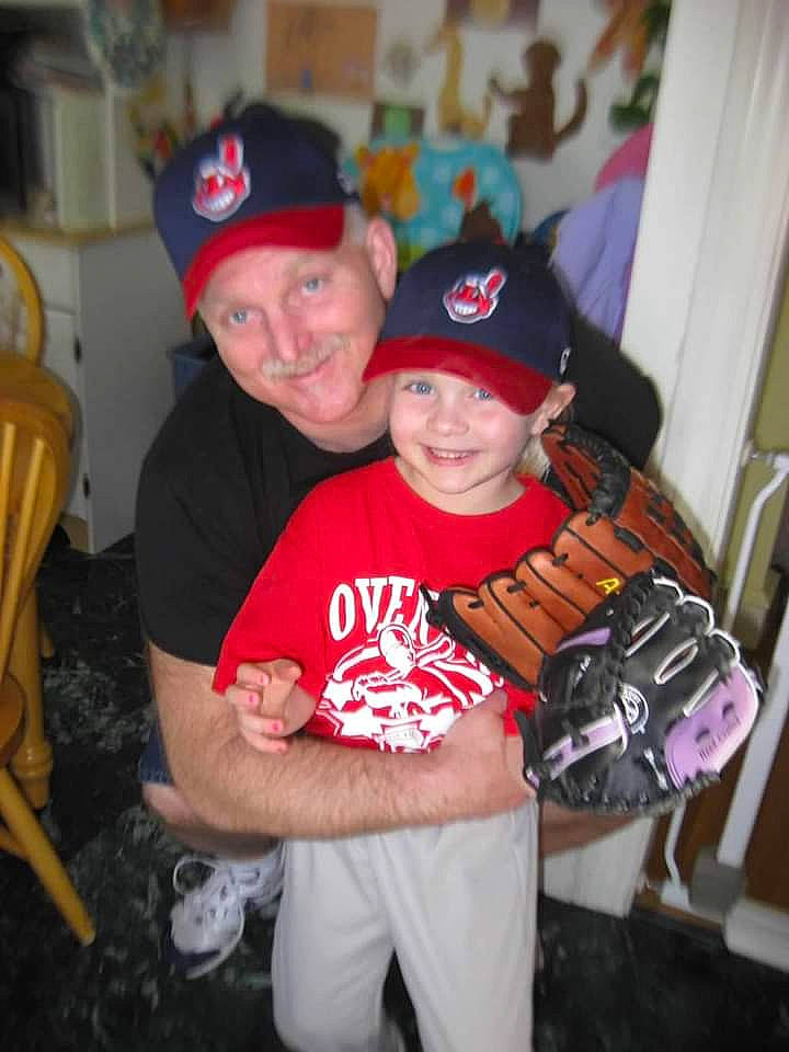 Bjorn'A joined the competition — help win amazing prizes! adult, baseball_cap, baseball_glove, boy, casual_clothing, chair, child, family, floor, furniture, happy, home, indoor, man, person, portrait, red_shirt, smiling, sports, wall_decor