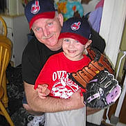 Bjorn'A joined the competition — help win amazing prizes! adult, baseball_cap, baseball_glove, boy, casual_clothing, chair, child, family, floor, furniture, happy, home, indoor, man, person, portrait, red_shirt, smiling, sports, wall_decor