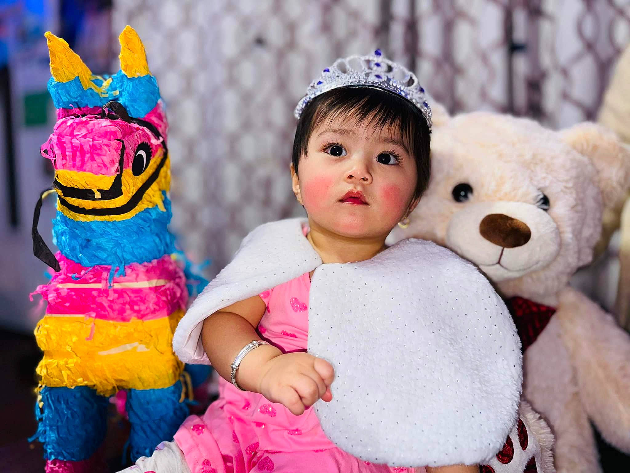 Amira Maharjan is registered to the contest to win money with this photo: baby, baby_toddler_clothing, child, event, facial_expression, fun, fur, happy, headgear, interaction, magenta, party_supply, person, pink, plush, purple, stuffed_toy, teddy_bear, textile, toddler