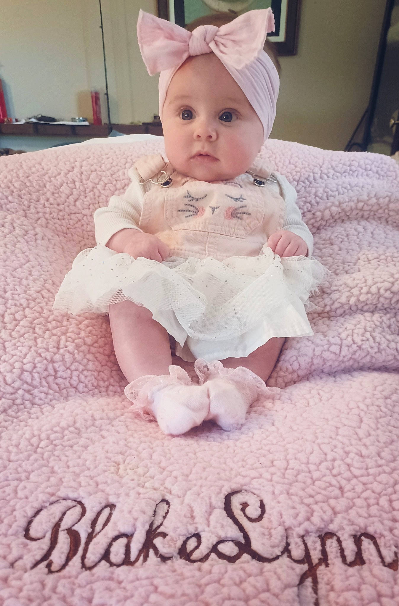 Blakelynn is registered to the contest to win money with this photo: baby, baby_toddler_clothing, birthday_cake, cake, cake_decorating, cake_decorating_supply, cheek, costume_hat, dessert, happy, headband, headwear, peach, person, pink, ruffle, sitting, skin, sleeve, sugar_cake
