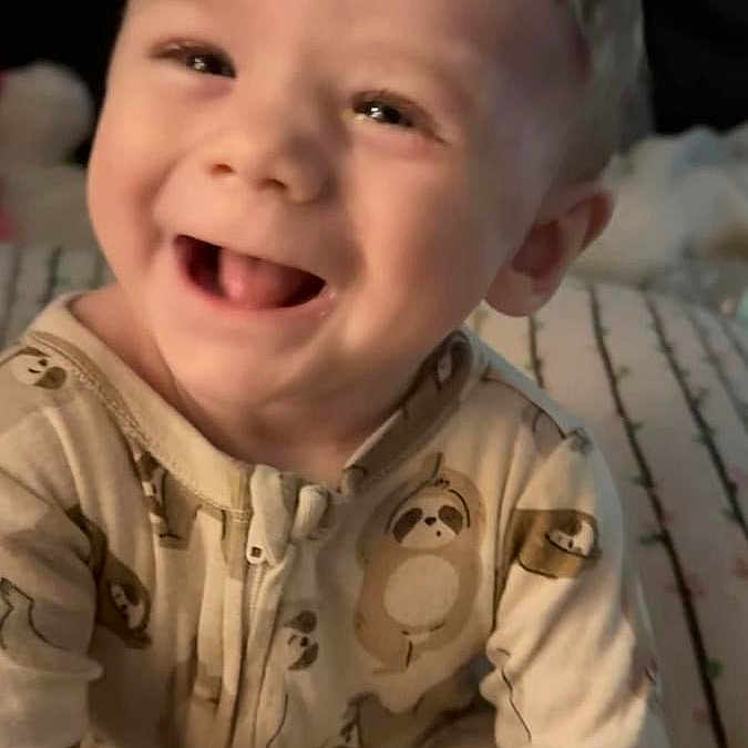 Dawson is registered to the contest to win money with this photo: baby, babylaughing, clothing, coat, face, happy, head, laughing, person, smile