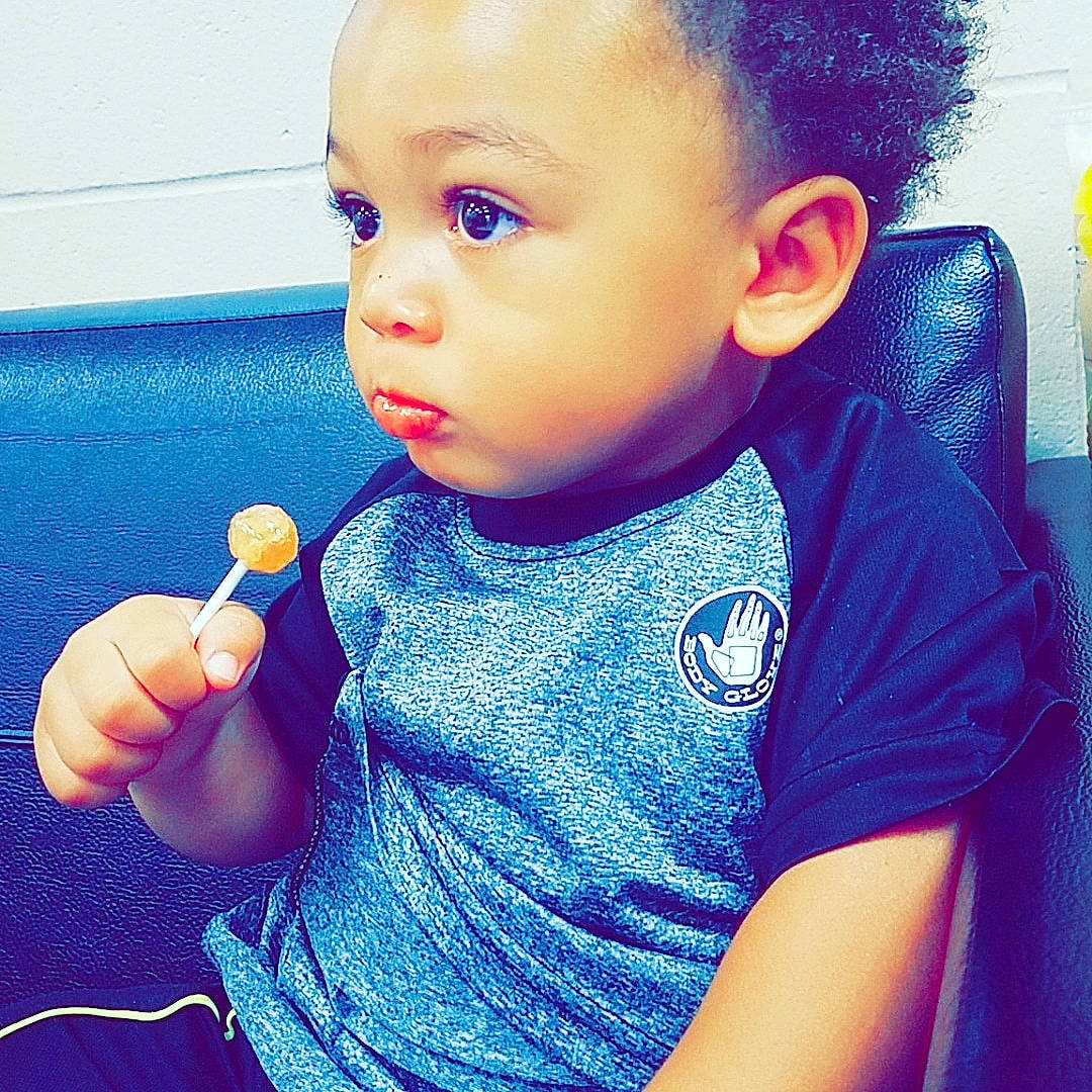 Daylen is registered to the contest to win money with this photo: black_hair, blue, boy, cheek, child, chin, cool, ear, eye, face, finger, forehead, fun, head, lip, mouth, nose, person, skin, toddler