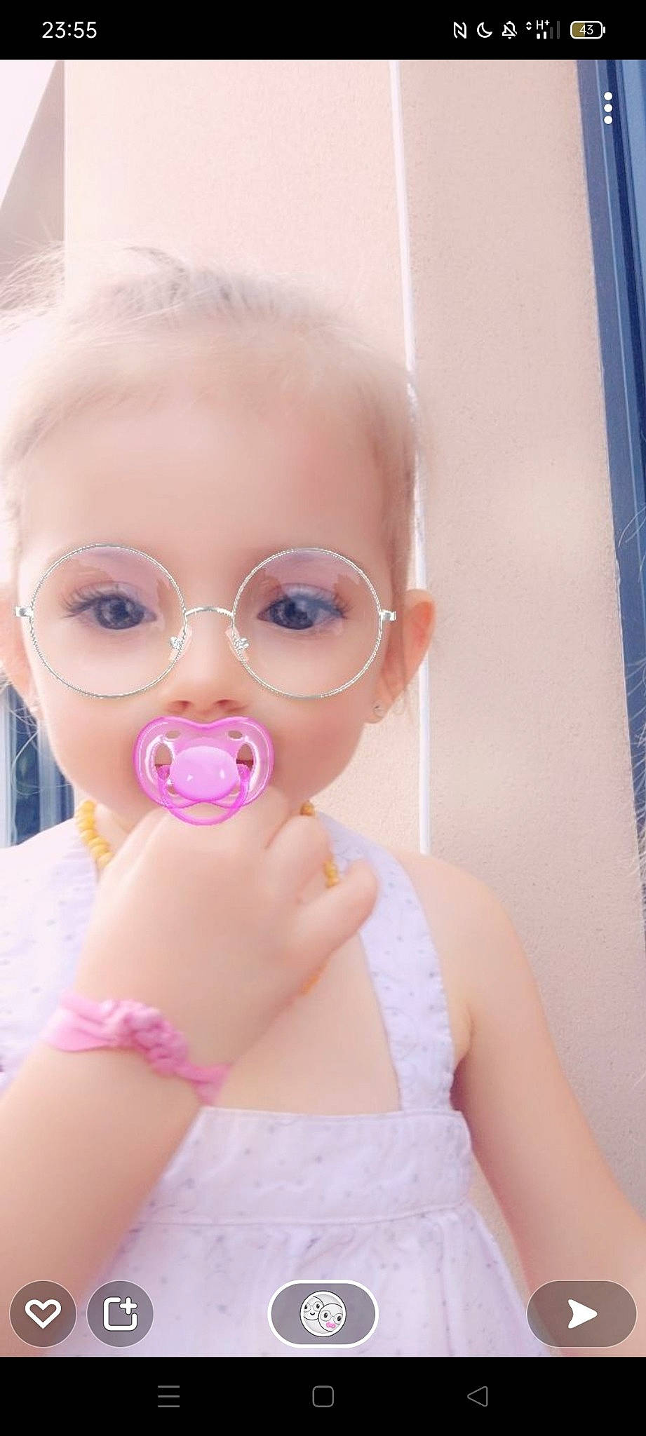 Alanna a rejoint le concours — aidez-le/la à gagner de superbes lots ! baby, baby_toddler_clothing, doll, dress, eye, eyebrow, eyelash, eyewear, gesture, glasses, hairstyle, iris, lip, neck, nose, person, pink, shoulder, skin, toy