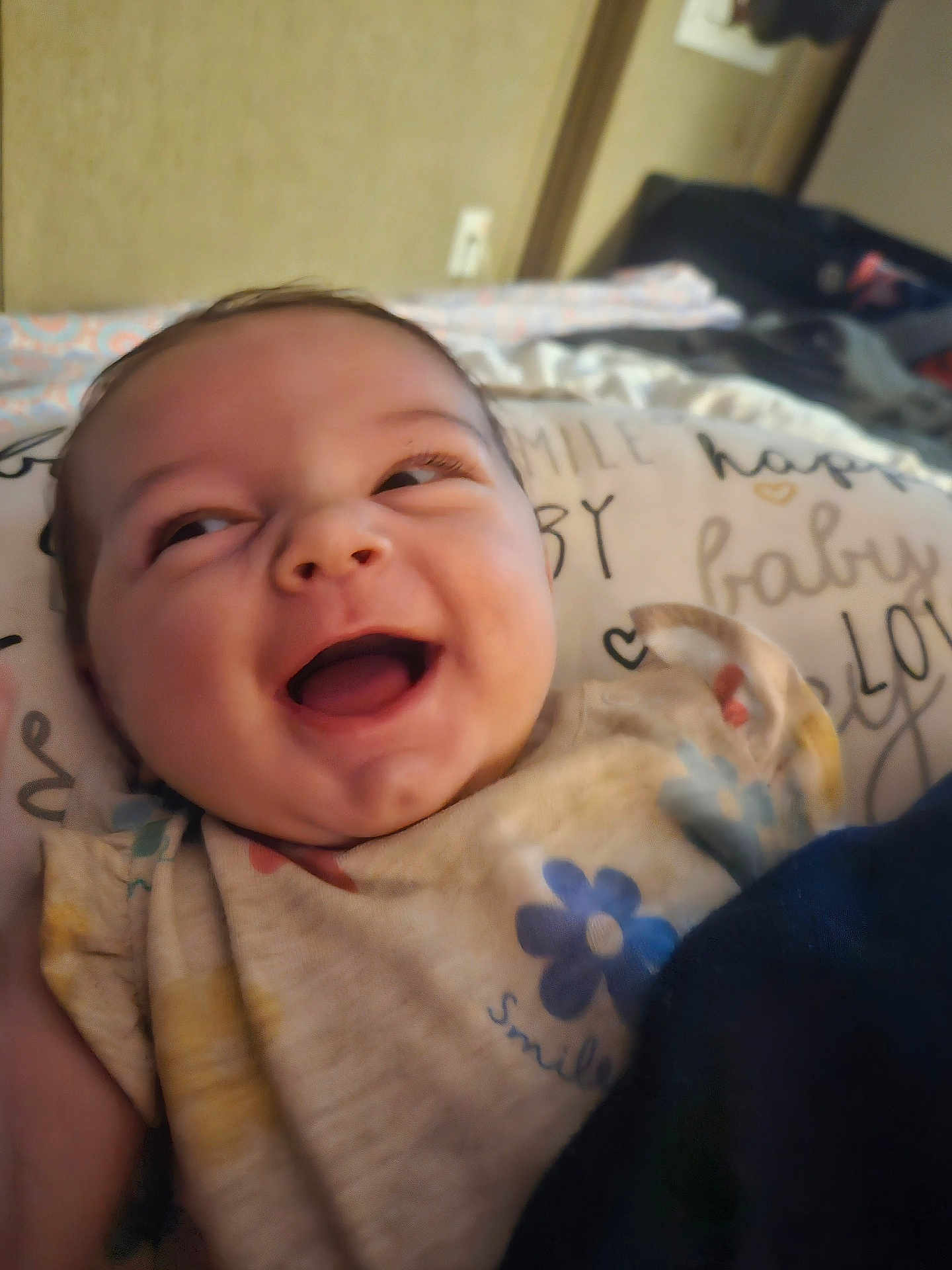 Emberlee joined the competition — help win amazing prizes! baby, smiling, face, infant, clothing, pillow, happy, cute, child, closeup, indoors, person, soft, young, cheerful, expression, portrait, toddler, sleepwear, blanket