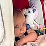 baby, blanket, blue_eyes, car_seat, child, closeup, comfort, cute, face, infant, person, pink, plush_toy, seatbelt, snuggle, soft_toy, toddler, toy, unicorn, white