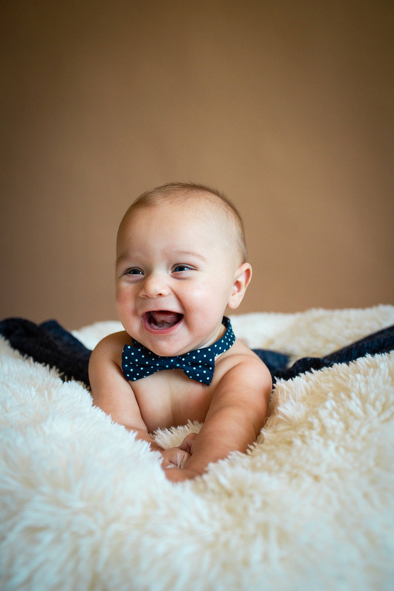 Jax is registered to the contest to win money with this photo: baby, baby_toddler_clothing, child, dress, event, flash_photography, flooring, formal_wear, fun, fur, happy, iris, joy, laugh, pattern, person, product, sitting, skin, sleeve