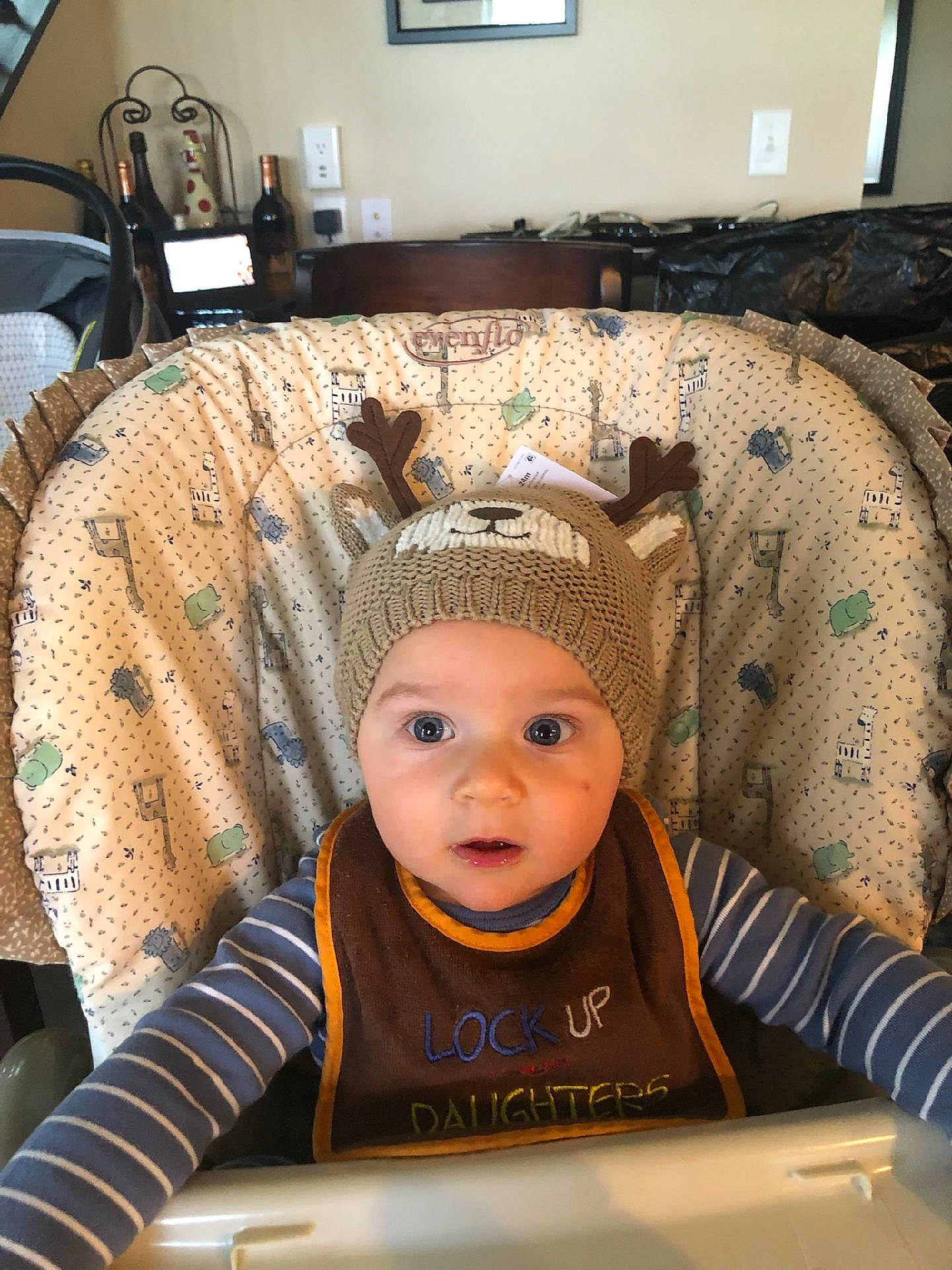 Jax joined the competition — help win amazing prizes! baby, baby_toddler_clothing, beanie, cap, child, cool, costume_hat, fashion_accessory, flooring, fun, fur, happy, headgear, headwear, knit_cap, person, room, sitting, surprise, t_shirt