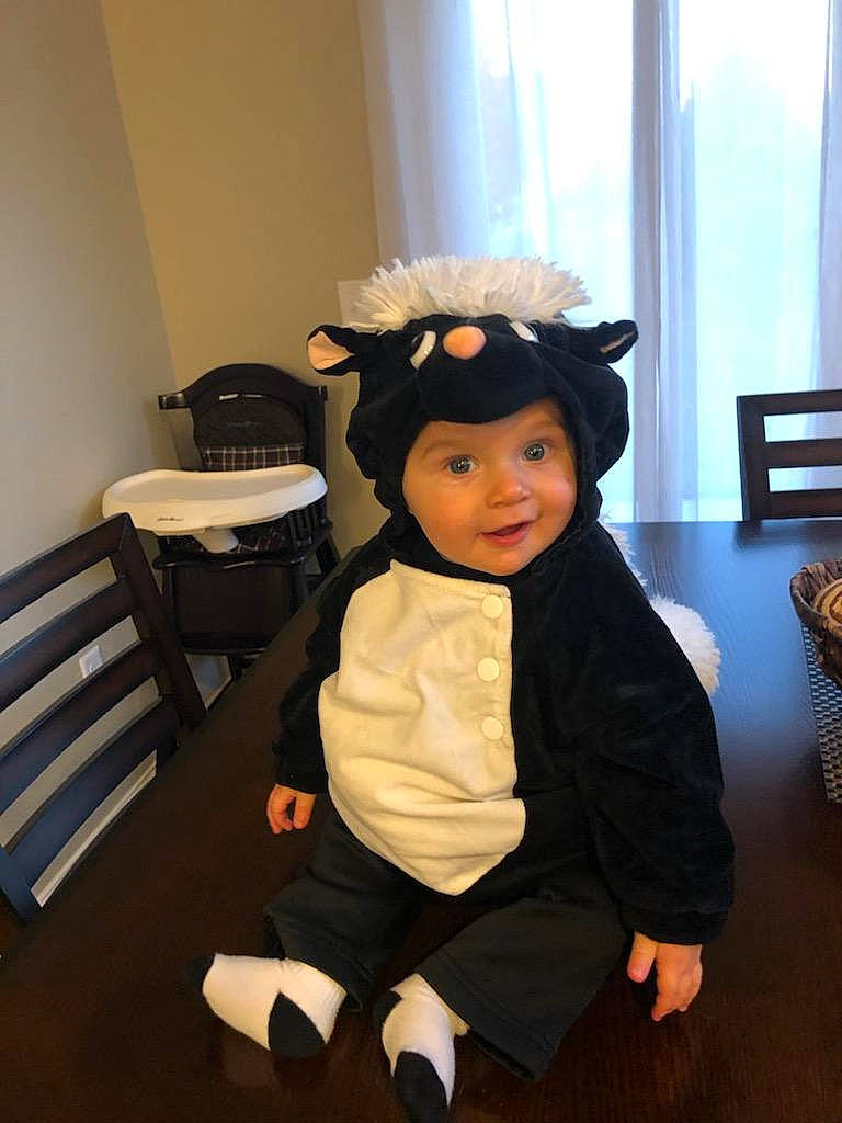 Jax is registered to the contest to win money with this photo: chair, child, costume_hat, curtain, event, floor, flooring, fun, furniture, hairstyle, happy, hat, headgear, headwear, person, room, smile, sun_hat, table, toddler