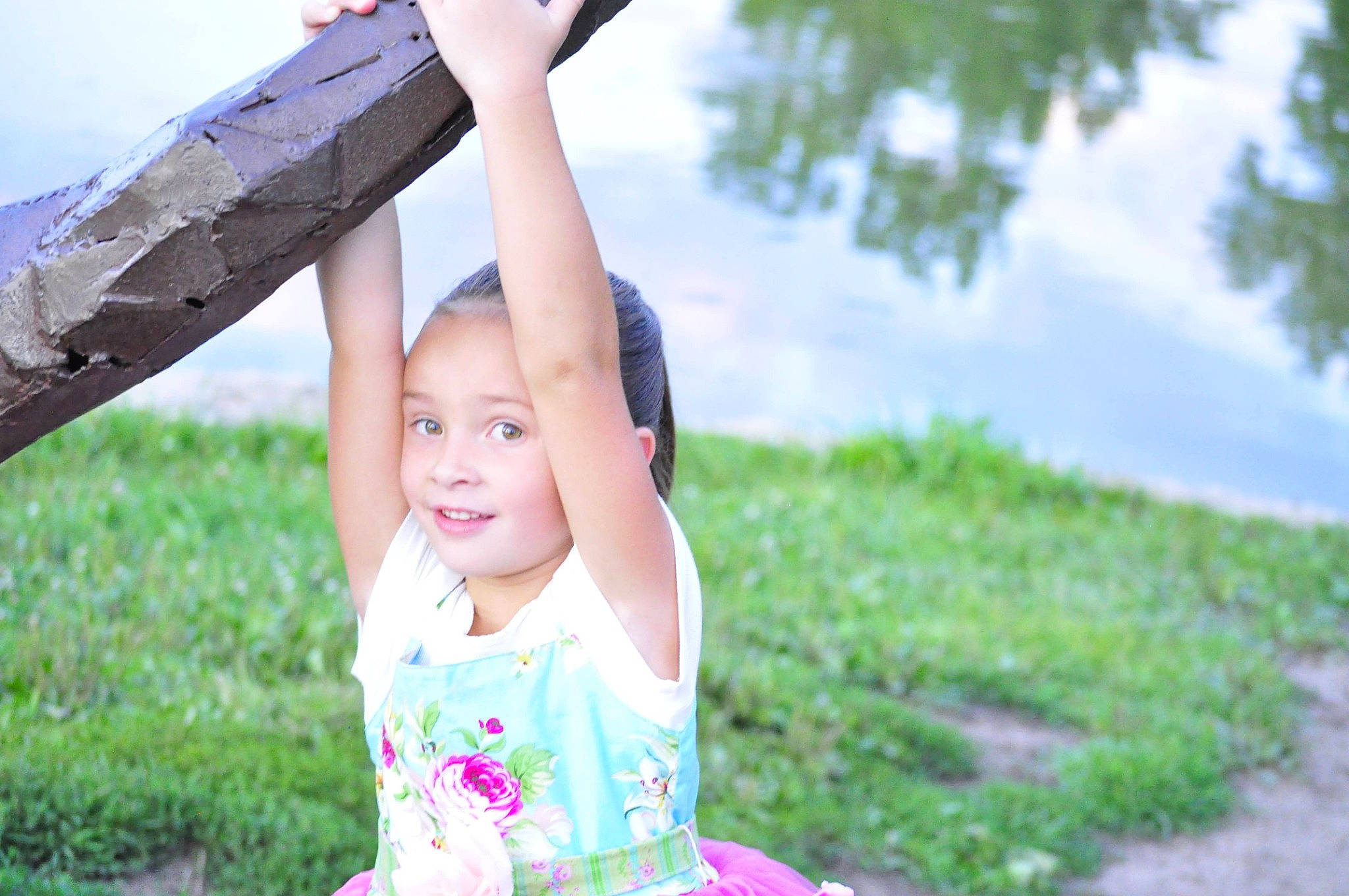 Mckenzie is registered to the contest to win money with this photo: child, flash_photography, fun, gesture, grass, grassland, happy, joy, landscape, leaf, leisure, outdoor_play_equipment, people_in_nature, person, plant, play, recreation, sitting, smile, swing