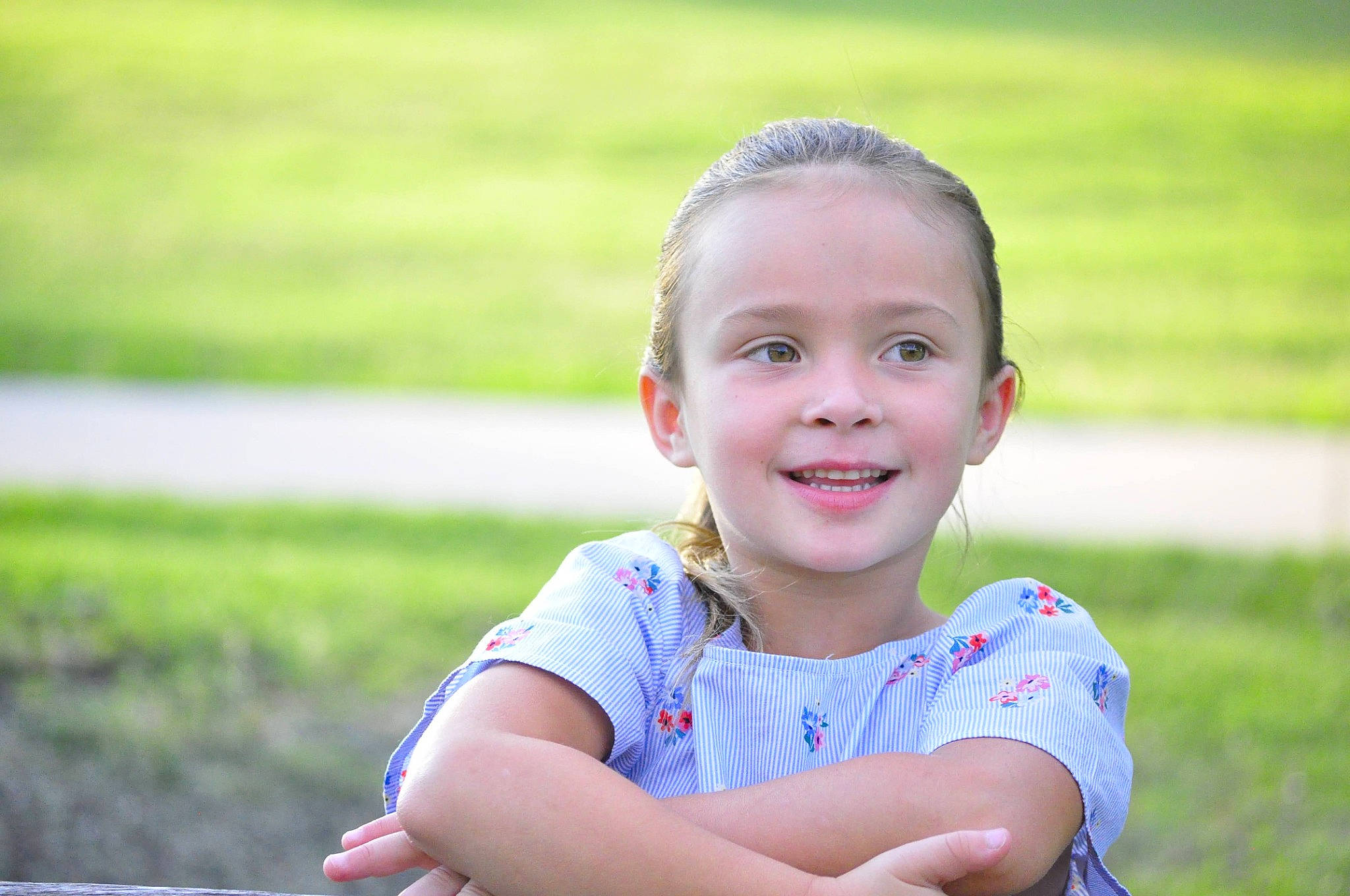 Mckenzie joined the competition — help win amazing prizes! baby_toddler_clothing, blond, child, electric_blue, flash_photography, fun, grass, grass_family, happy, joy, laugh, leisure, people_in_nature, person, plant, portrait_photography, recreation, sitting, smile, summer