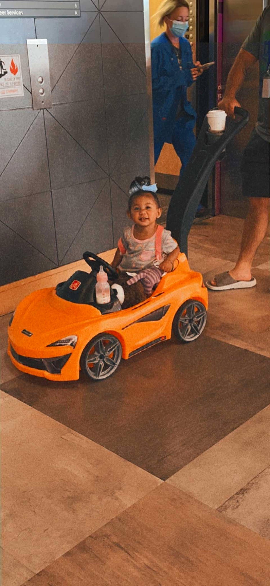 Khalani joined the competition — help win amazing prizes! alloy_wheel, automotive_design, automotive_exterior, automotive_lighting, automotive_tire, automotive_wheel_system, bumper, car, fender, headlamp, hood, motor_vehicle, orange, person, personal_luxury_car, rim, rolling, smile, tire, vehicle