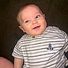 baby, child, infant, smiling, happy, portrait, face, eyes, outdoorless, seated, shirt, striped_shirt, anchor, clothing, chair, furniture, indoors, candid, flash_photography, close_up