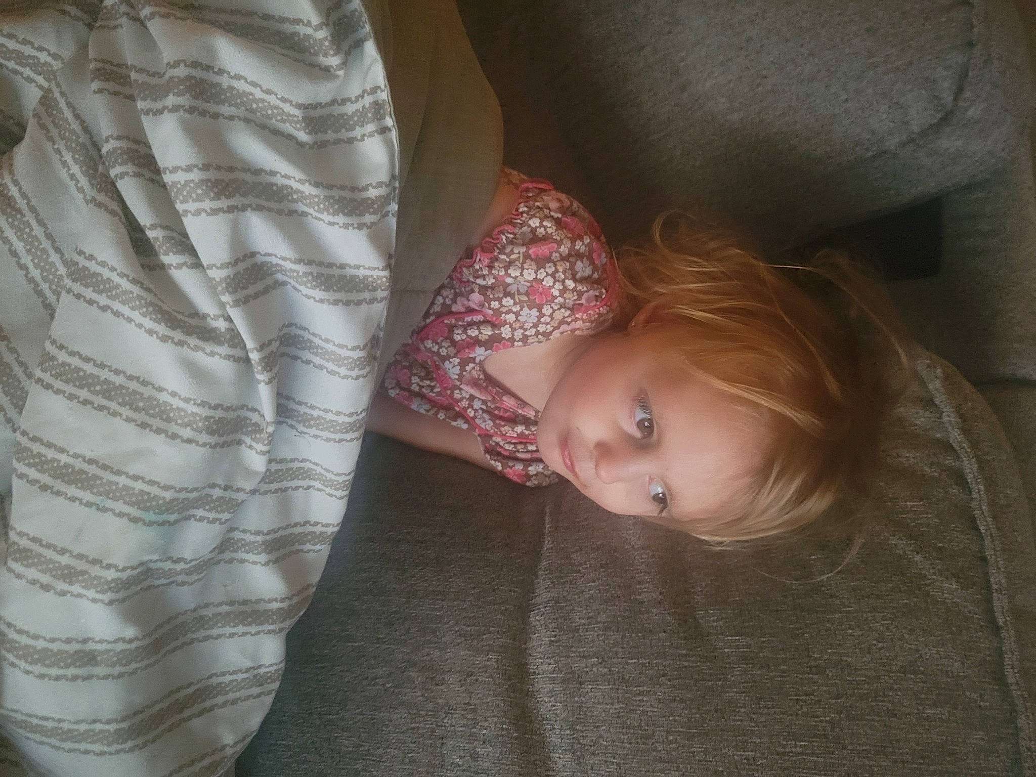 Ember is registered to the contest to win money with this photo: baby, baby_toddler_clothing, blond, cheek, child, comfort, couch, elbow, flooring, iris, linens, nose, pattern, person, plaid, room, sitting, skin, sleeve, toddler