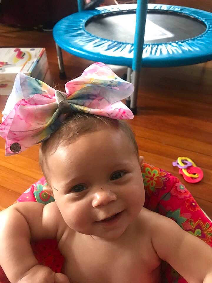 Abriella is registered to the contest to win money with this photo: baby, cheek, child, ear, headgear, person, pink, smile, toddler