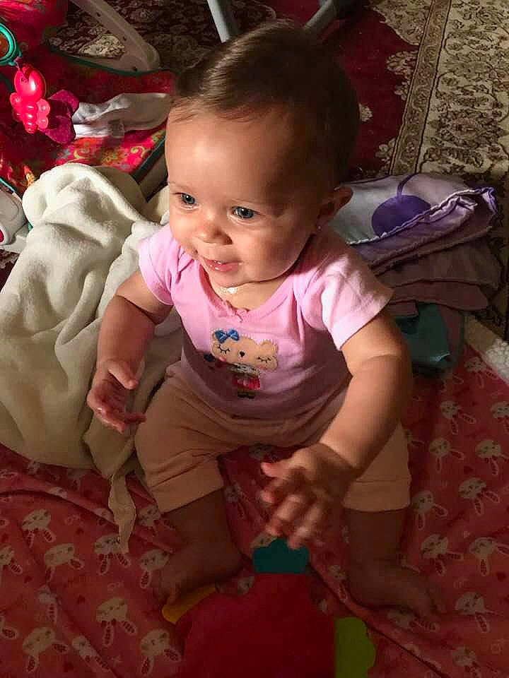 Abriella joined the competition — help win amazing prizes! baby, cheek, child, eye, face, fun, head, human, iris, lip, magenta, mouth, nose, person, pink, play, sitting, skin, smile, toddler