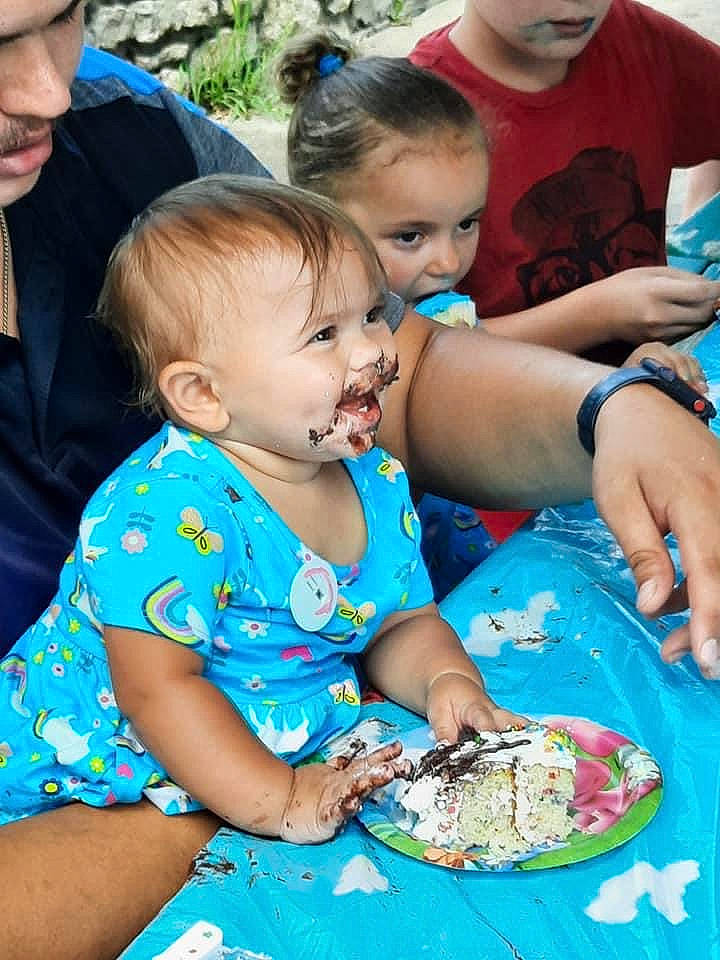 Haelyn is registered to the contest to win money with this photo: baby, blue, cake, chair, child, dress, event, food, fun, grass, green, happy, person, photograph, plate, recreation, sharing, summer, t_shirt, tableware