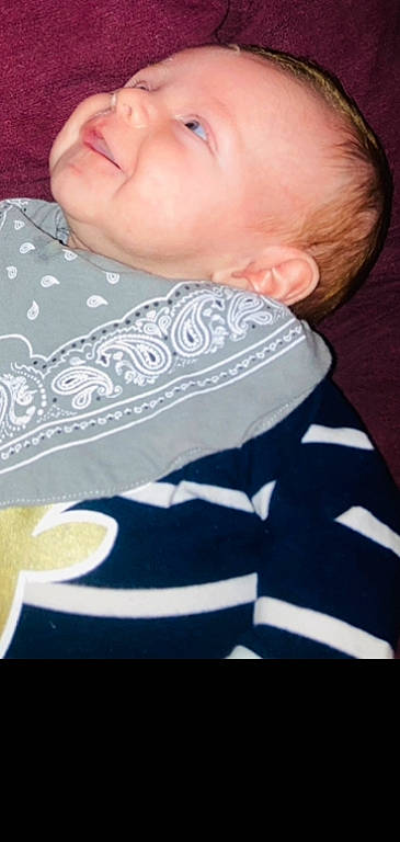 Douglas is registered to the contest to win money with this photo: baby, cheek, child, comfort, cup, dishware, drinkware, elbow, finger, hairstyle, happy, linens, mouth, neck, pattern, person, serveware, sleeve, smile, toddler