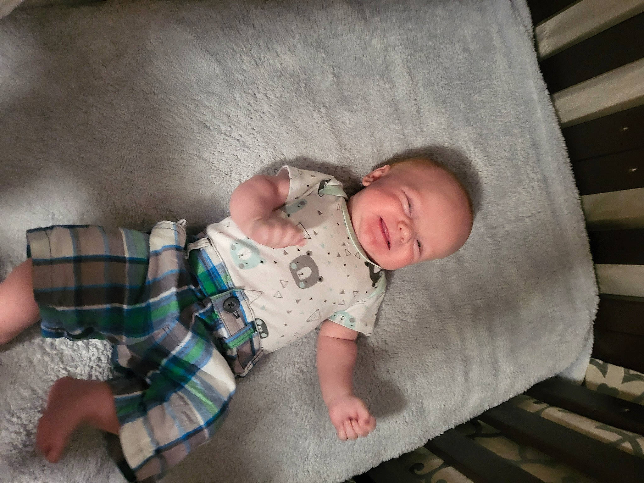 Mathayus is registered to the contest to win money with this photo: baby, baby_products, baby_toddler_clothing, bedding, bedtime, child, comfort, flooring, linens, mammal, pattern, person, plaid, room, sitting, skin, sleeve, tartan, textile, toddler