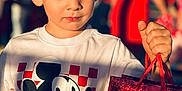 Erick joined the competition — help win amazing prizes! blurry_background, boy, candid, casual_clothing, child, closeup, crowd, expression, gift_bag, haircut, holding, mickey_mouse, outdoor, portrait, red_color, shadow, shopping_bag, summer, sunlight, tshirt
