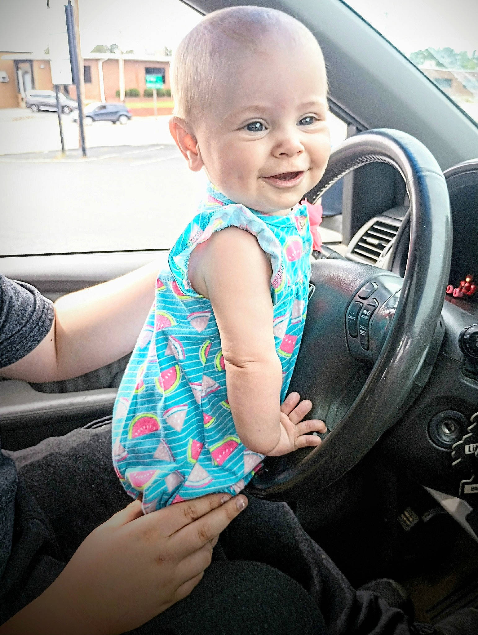 Kayleigh is registered to the contest to win money with this photo: auto_part, automotive_design, automotive_exterior, automotive_tire, baby_toddler_clothing, car, child, fun, happy, motor_vehicle, person, personal_luxury_car, photograph, plant, smile, snapshot, steering_wheel, thigh, toddler, vehicle_door
