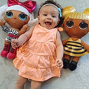 Kamyla a rejoint le concours — aidez-le/la à gagner de superbes lots ! baby, child, colorful, cute, doll, dress, fabric, floor, happy, headband, indoor, infant, large_eyes, lying_down, person, playful, plush, smile, soft, toy