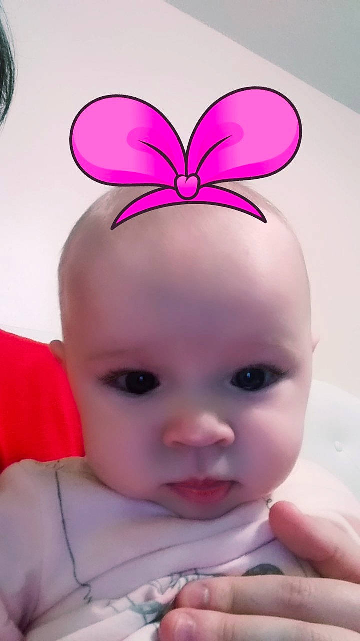 Gwen is registered to the contest to win money with this photo: cheek, chin, ear, eye, eyebrow, eyelash, facial_expression, finger, gesture, hairstyle, hand, happy, head, iris, lip, nose, organ, person, pink, skin