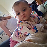 Serenity joined the competition — help win amazing prizes! toddler, child, pajamas, indoor, blanket, woman, phone, television, toy, carpet, person, face, portrait, home, furniture, casual, sitting, curious, clothing, living_room