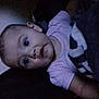 Serenity is registered to the contest to win money with this photo: baby, infant, child, face, eyes, mouth, clothing, blanket, indoor, portrait, person, sleepwear, soft_light, expression, young_child, head, skin, cute, lying_down, toddler