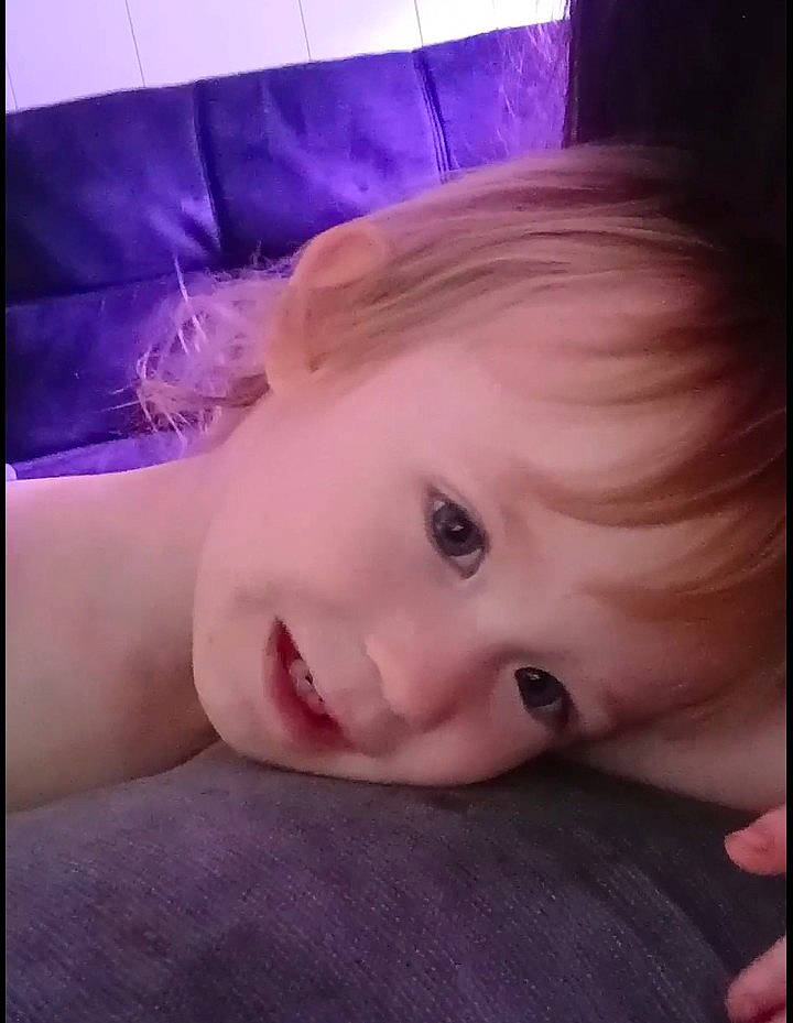 Raven is registered to the contest to win money with this photo: baby, chest, cloud, ear, electronic_device, eyelash, face, happy, head, human_body, iris, jaw, joy, lip, mouth, neck, person, pink, skin, sky