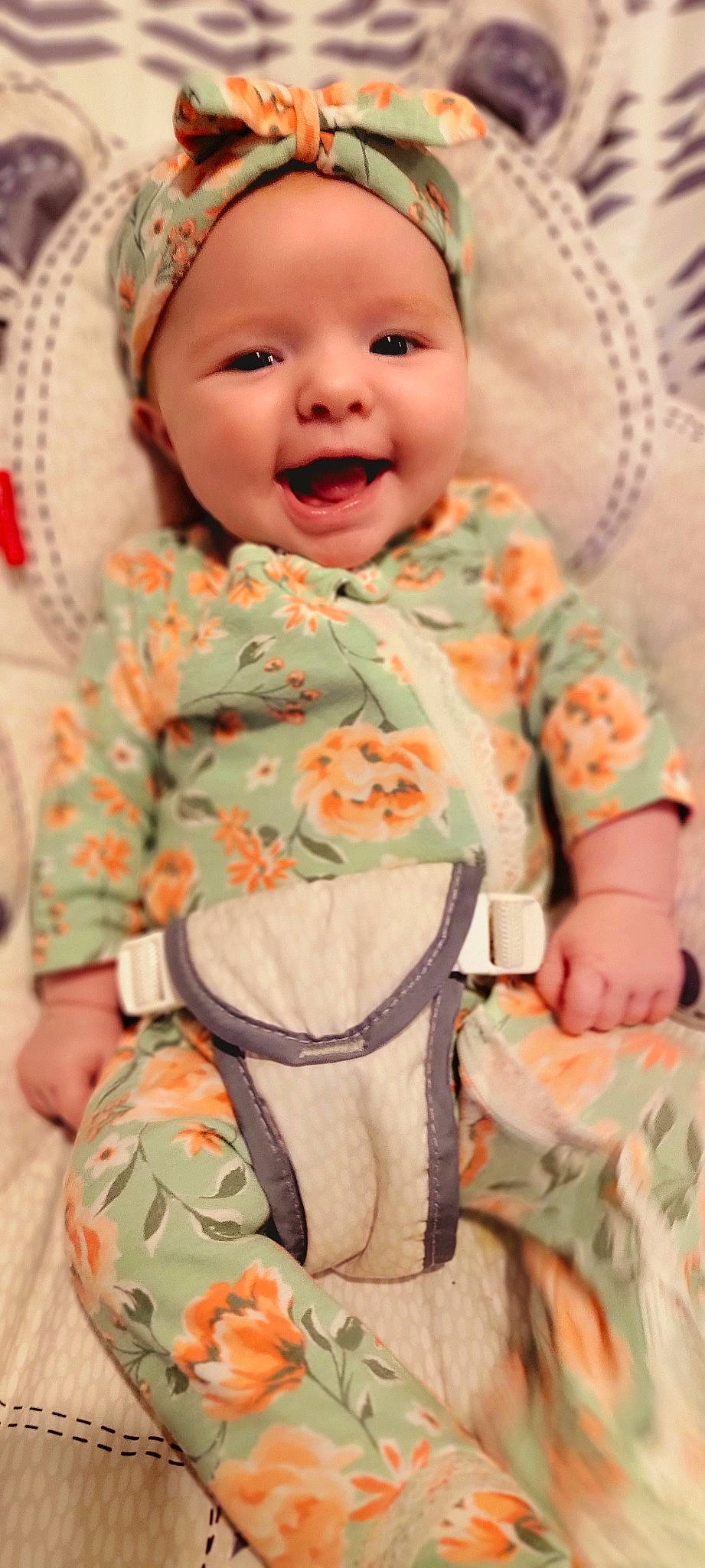 Emalee is registered to the contest to win money with this photo: baby, baby_toddler_clothing, cap, cheek, chin, comfort, dress, face, green, happy, headwear, nose, orange, outerwear, person, pink, skin, sleeve, smile, t_shirt