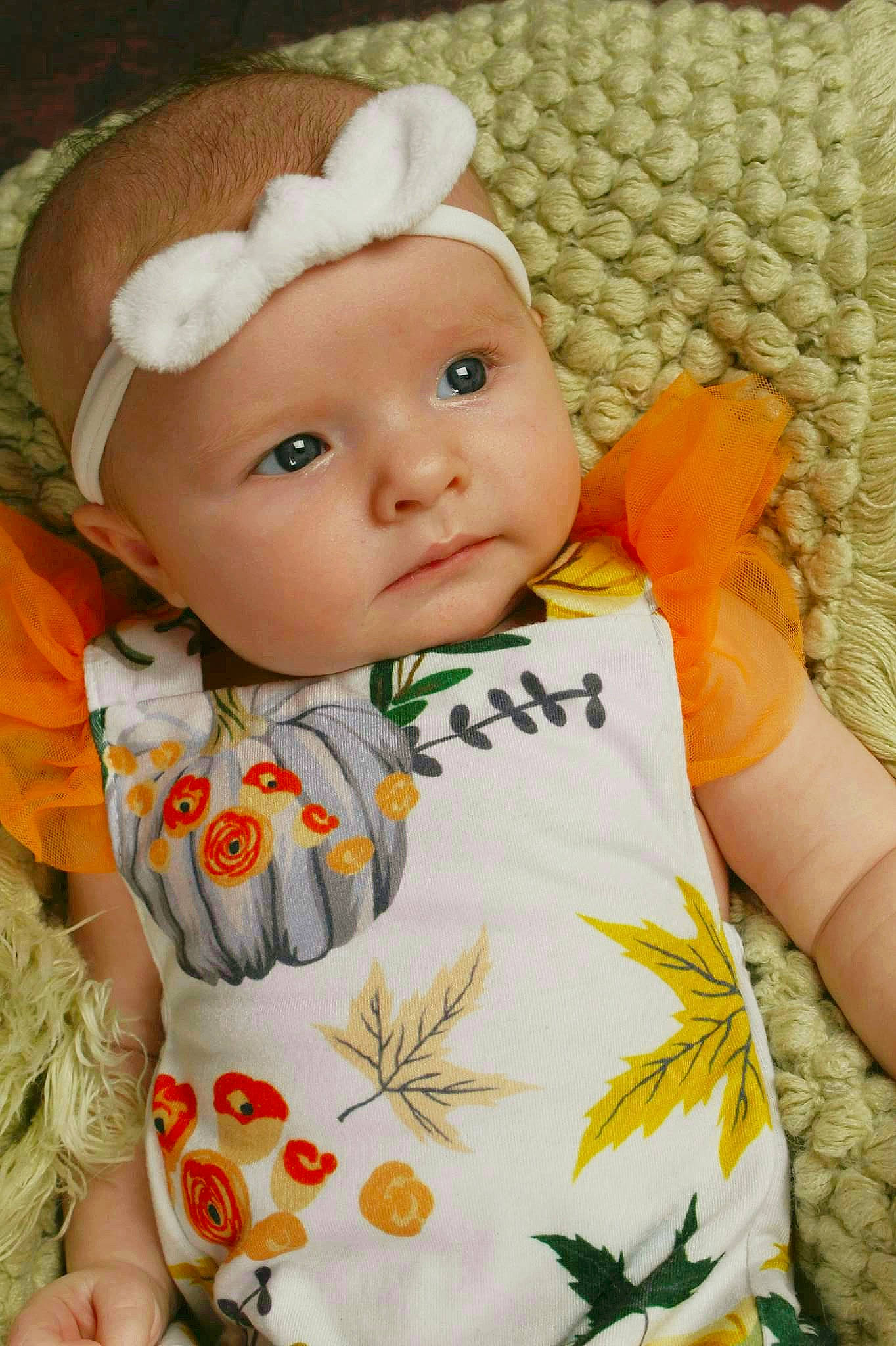 Emalee is registered to the contest to win money with this photo: baby, baby_toddler_clothing, cap, cheek, chin, clothing, dress, face, hairstyle, headgear, headwear, iris, lip, orange, outerwear, person, skin, sleeve, t_shirt, textile
