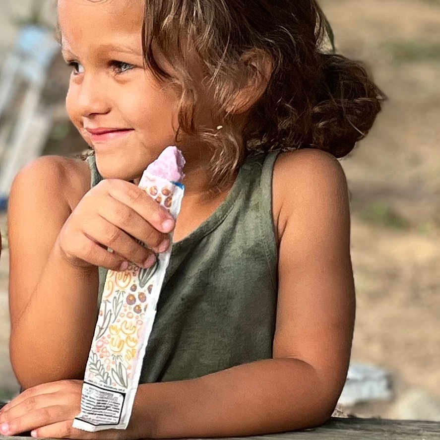 Londyn is registered to the contest to win money with this photo: bodypart, child, clothing, cream, dessert, dress, face, female, finger, food, girl, hand, happy, head, icecream, person, photography, portrait, smile, wood