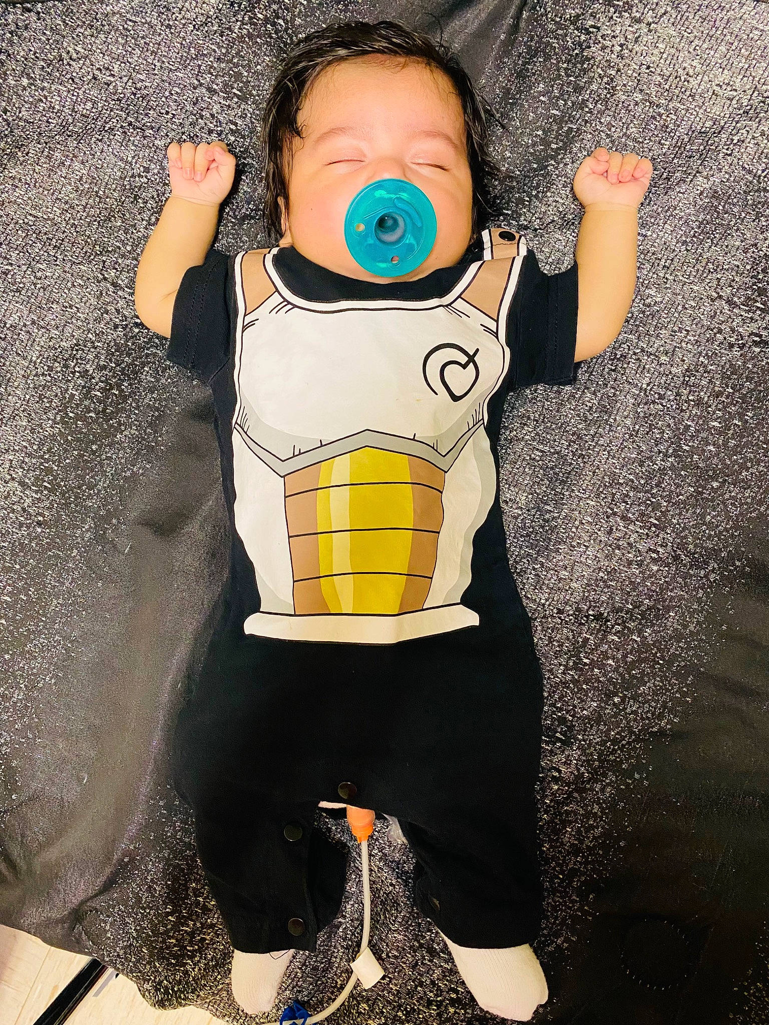 Henry Jr. is registered to the contest to win money with this photo: arm, baby_toddler_clothing, blue, cool, finger, flash_photography, fun, gesture, hand, happy, outerwear, personal_protective_equipment, product, shoulder, sleeve, sports_gear, standing, t_shirt, toddler, waist