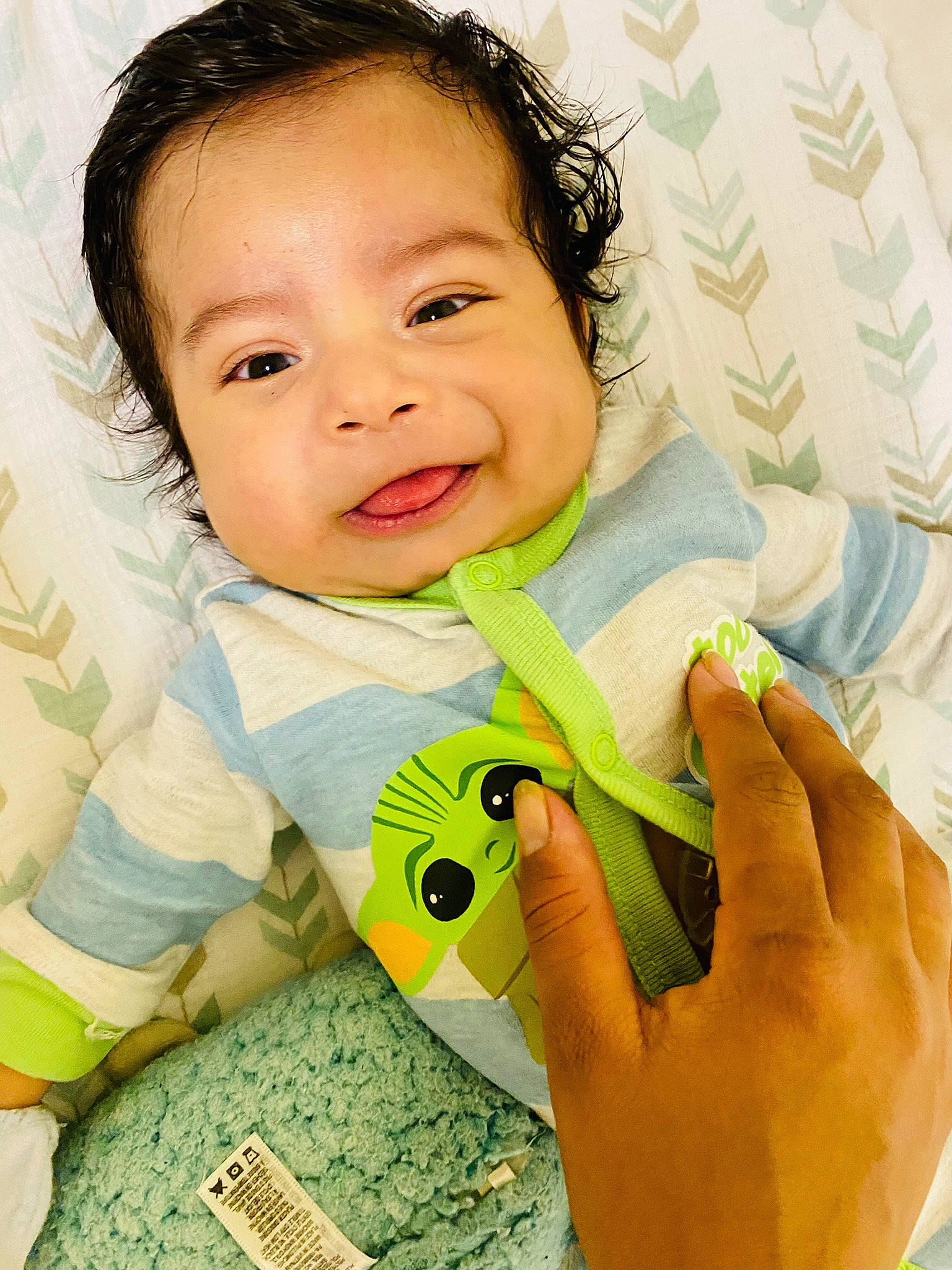 Henry Jr. is registered to the contest to win money with this photo: baby, baby_toddler_clothing, cheek, collar, comfort, eyelash, finger, gesture, hand, happy, iris, mouth, nail, neck, nose, person, skin, sleeve, smile, thumb