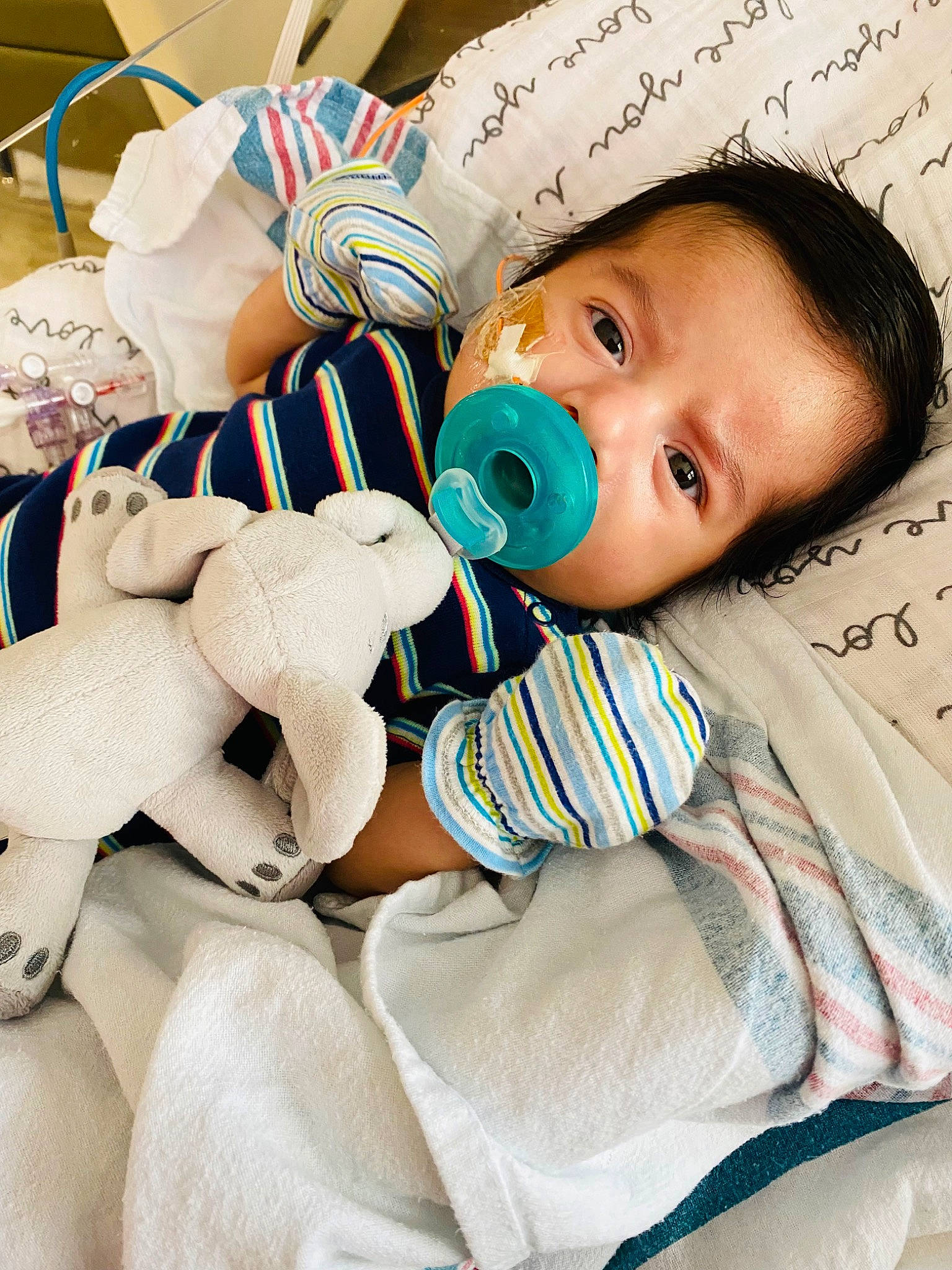 Henry Jr. is registered to the contest to win money with this photo: baby, baby_products, baby_safety, baby_sleeping, baby_toddler_clothing, cheek, child, comfort, eye, eyelash, finger, handwriting, happy, linens, person, product, skin, stuffed_toy, textile, toddler