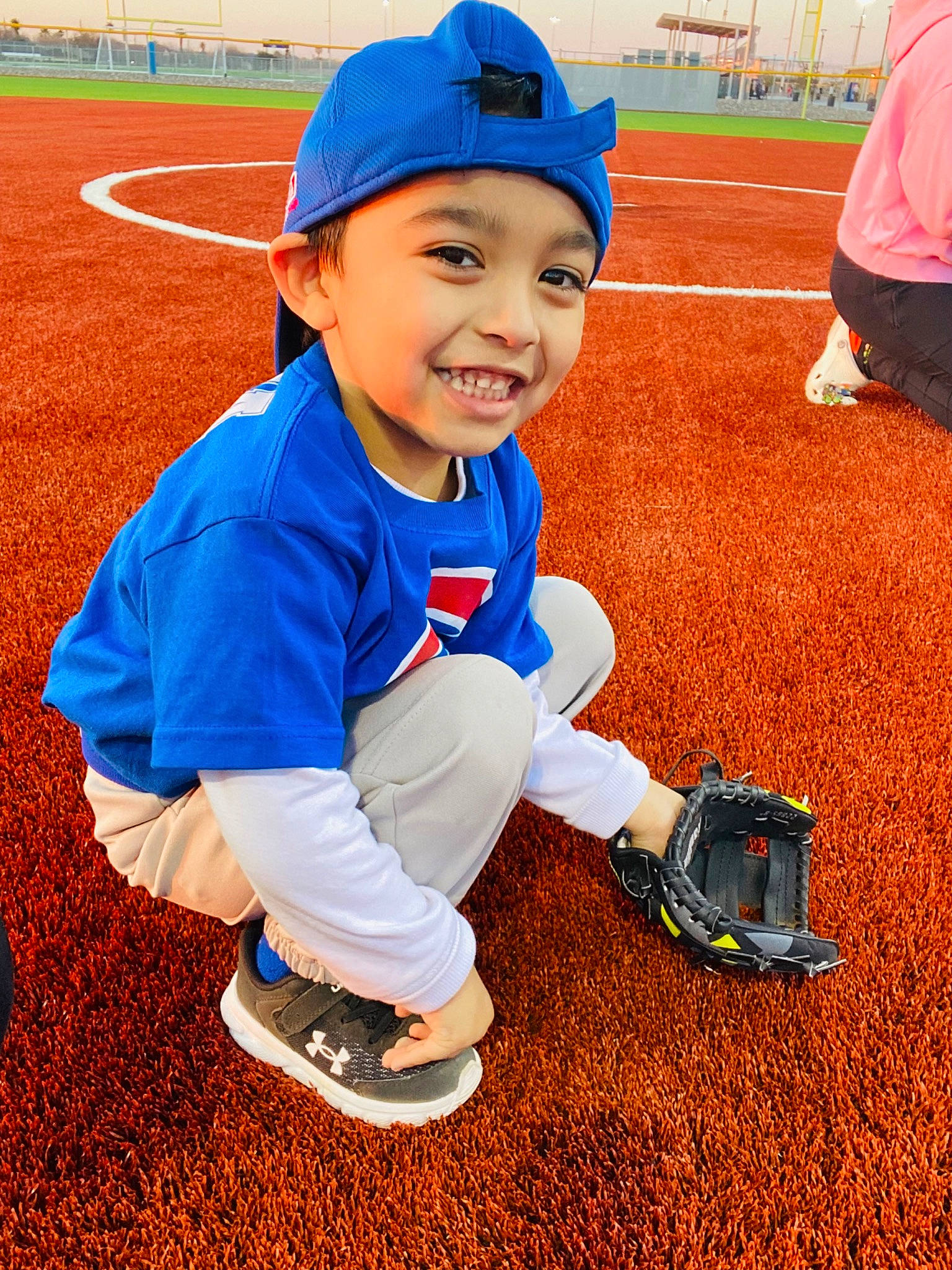 Ethan is registered to the contest to win money with this photo: ball_game, baseball_cap, baseball_equipment, baseball_park, baseball_player, baseball_protective_gear, bat_and_ball_games, competition_event, fun, grass, happy, headwear, joy, person, player, smile, sneakers, sports, sports_equipment, sports_gear