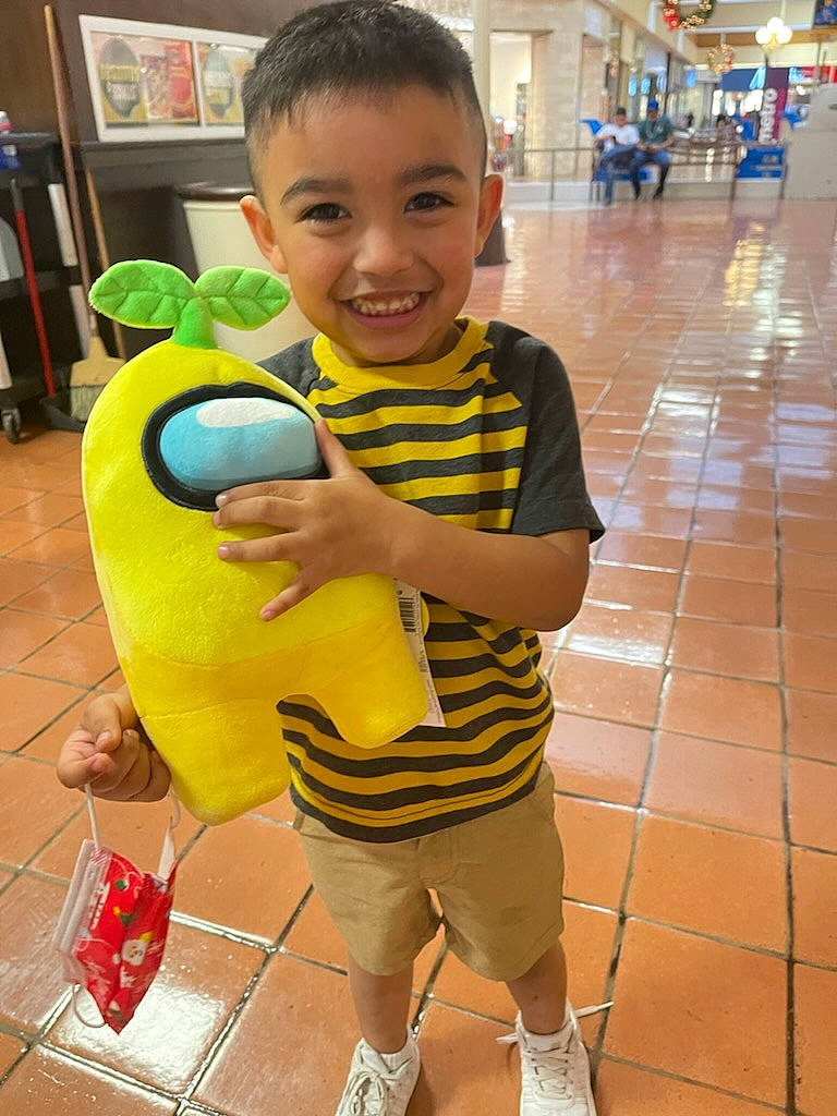 Ethan is registered to the contest to win money with this photo: child, flooring, fun, green, happy, head, joy, leg, leisure, person, recreation, shorts, skin, smile, snapshot, standing, summer, thigh, thumb, toddler