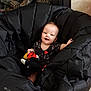 animal, baby, bird, blanket, bodypart, car, car_interior, carseat, clothing, coat, couch, face, furniture, head, jacket, person, photography, portrait, transportation, vehicle