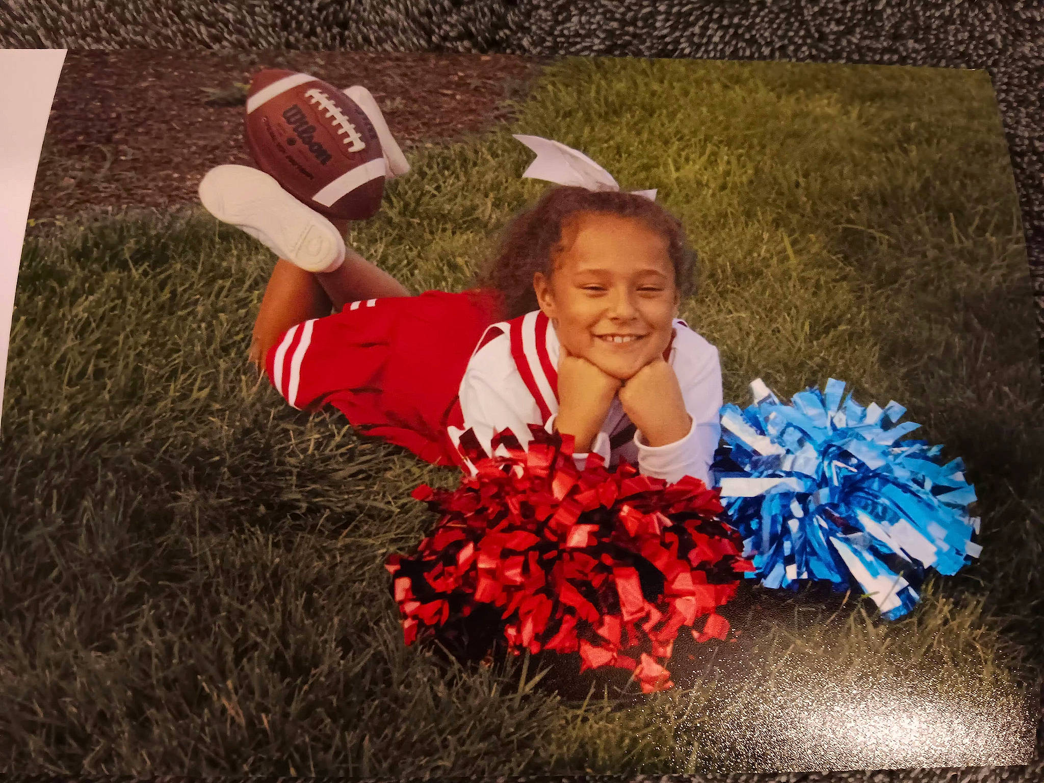 Breyanna joined the competition — help win amazing prizes! annual_plant, baseball_cap, bouquet, carmine, cheerleading, child, competition_event, electric_blue, event, flower, grass, happy, hat, joy, leaf, people_in_nature, person, petal, plant, smile